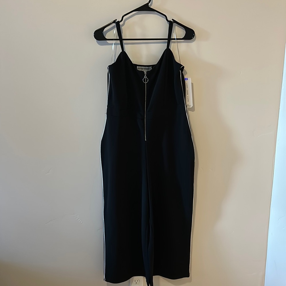 Black romper with white stripe down the side
